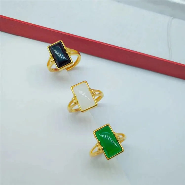 Adjustable brass gold-plated ring with gemstone inlays in black, green, or white colour options