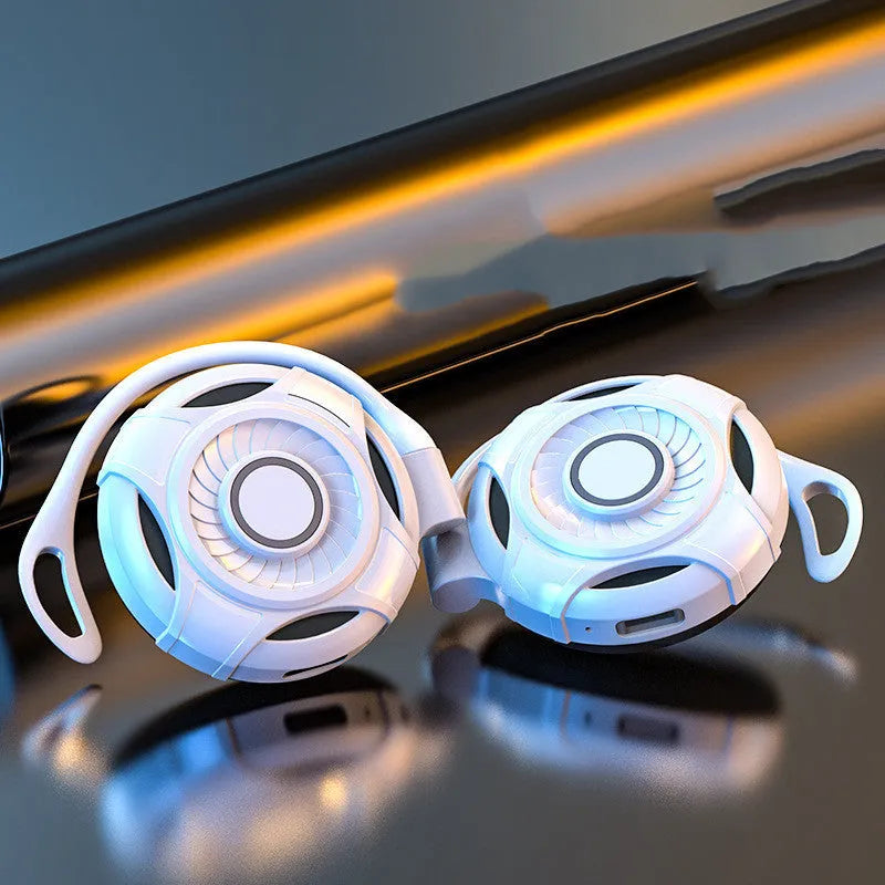Black and white wireless Bluetooth earphones with hanging ear design and USB charging