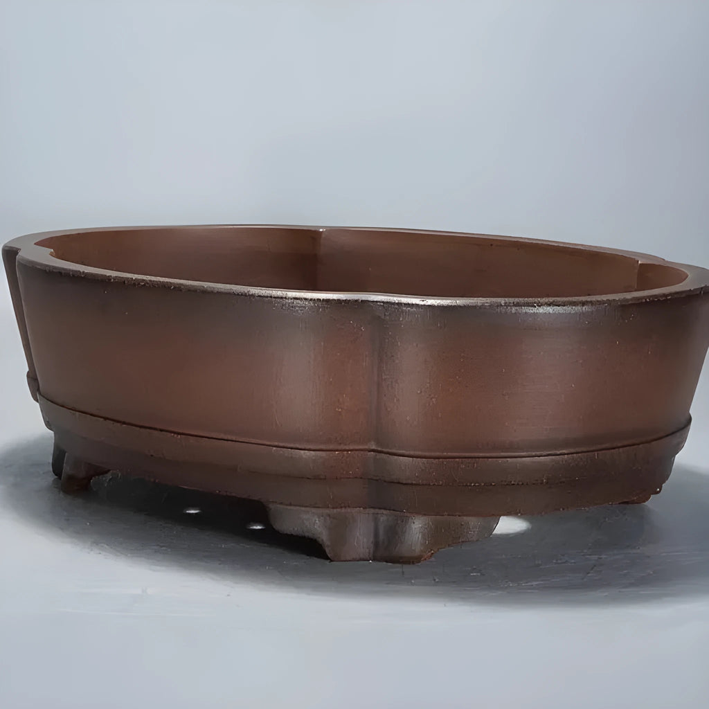 A simple classical-style purple clay bonsai pot for tabletop or floor plant display.