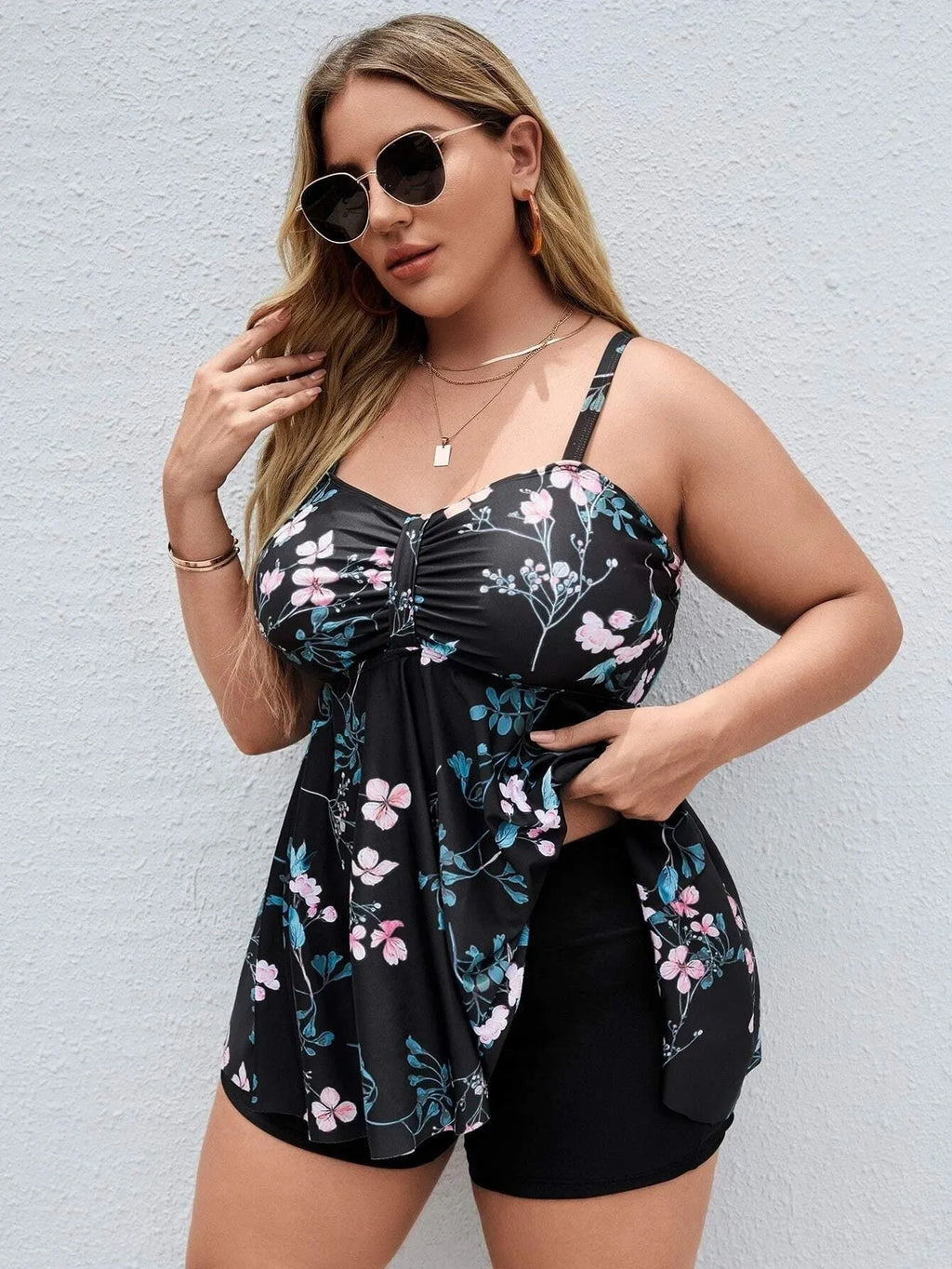 Women's floral print one-piece swimsuit with split colour design on mannequin