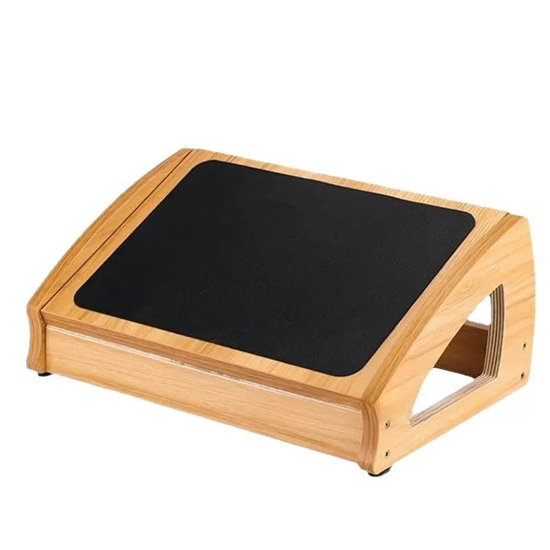 Adjustable bamboo office desk footstool in natural wood colour on a floor.