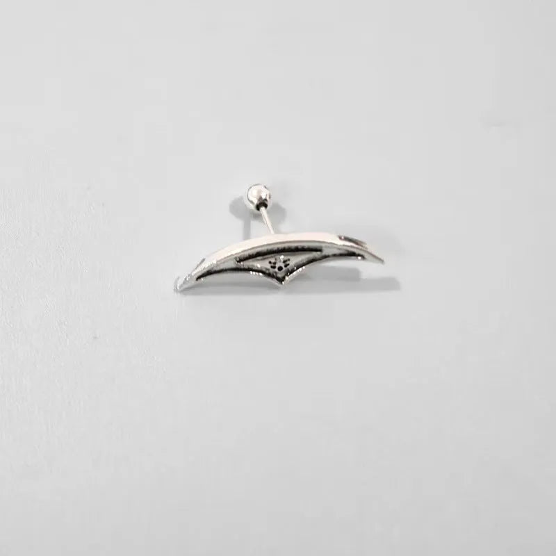 Spider web design stud earrings in gold and silver electroplated metal.