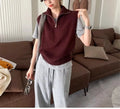 Woman's sleeveless half-zip knit vest with a 3D textured pattern in a solid colour.
