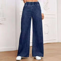 Women's light blue washed wide-leg jeans with straight cut trousers and mid-waist zip fly