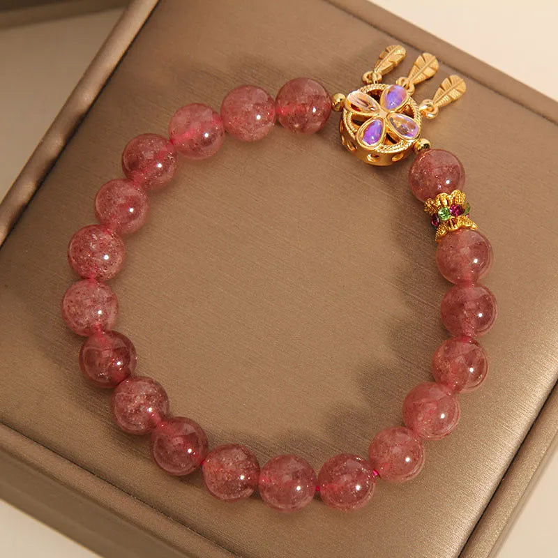Women's strawberry quartz bracelet with four-leaf dream catcher ball pendant, original crystal jewellery design