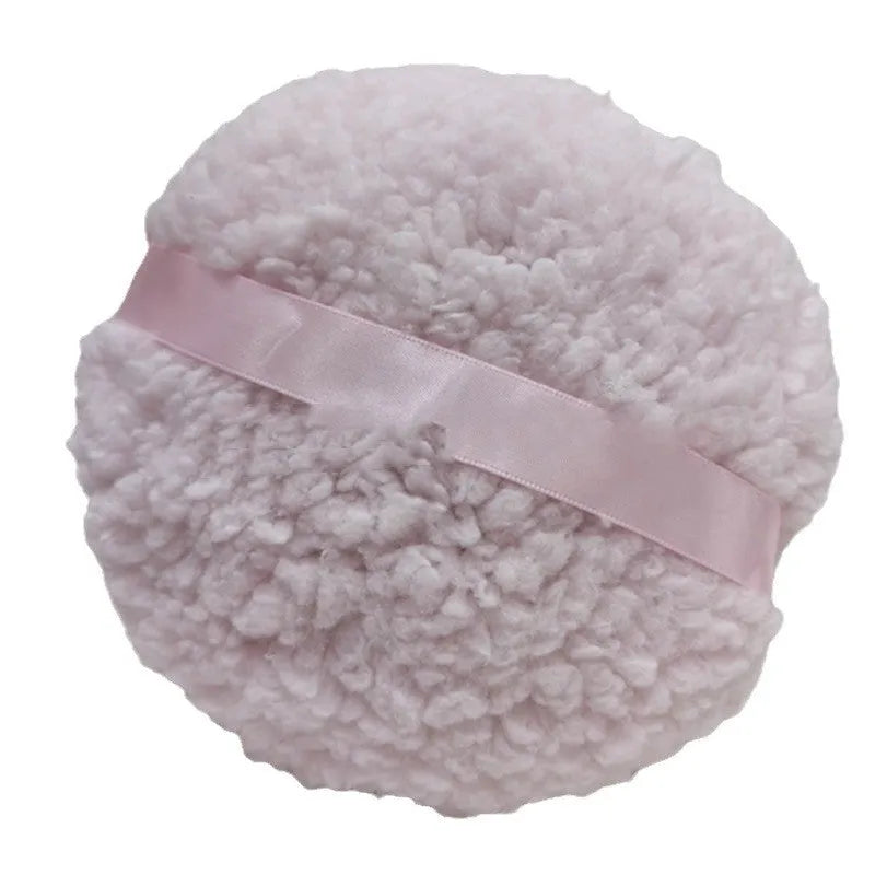 Oversized plush powder puff for makeup application in white colour with 150x75mm dimensions