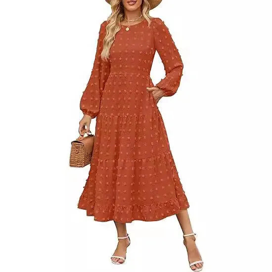 Beige long sleeve casual dress with ruffled sleeves, high waist, and round neck on a hanger.