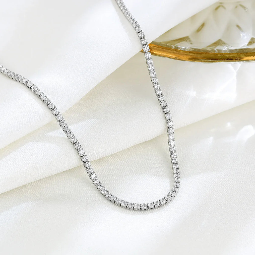 Women's sterling silver necklace with round diamond-cut pendant on silver chain