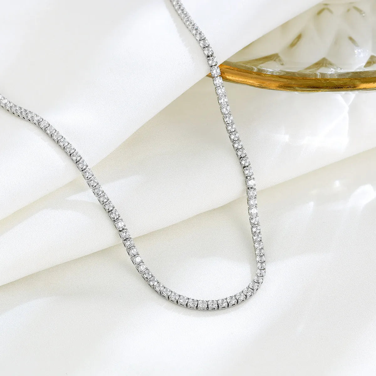 Women's sterling silver necklace with round diamond-cut pendant on silver chain