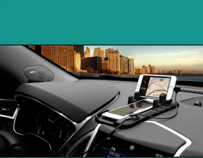 Black silicone car charging bracket with magnetic holder and three charging ports on a dashboard