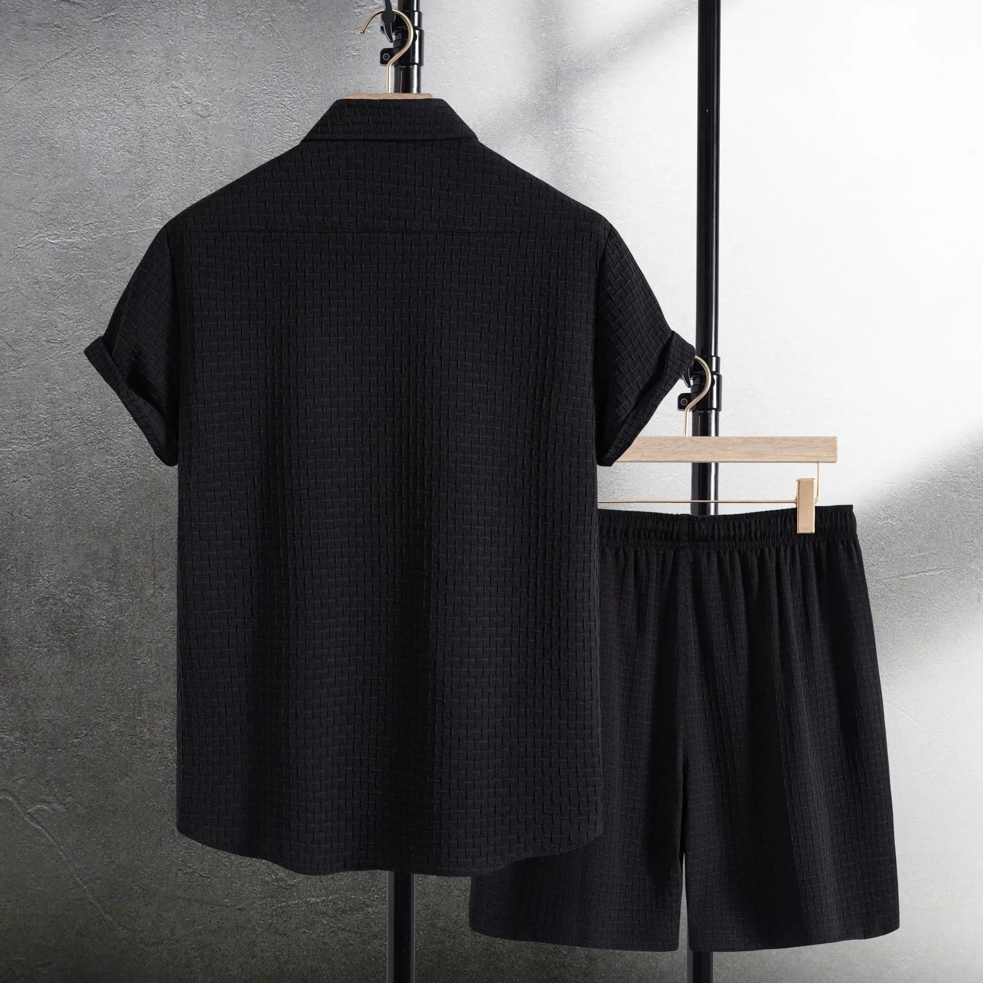 Men's loose cotton blend beach suit with short sleeve cardigan shirt and shorts in black.