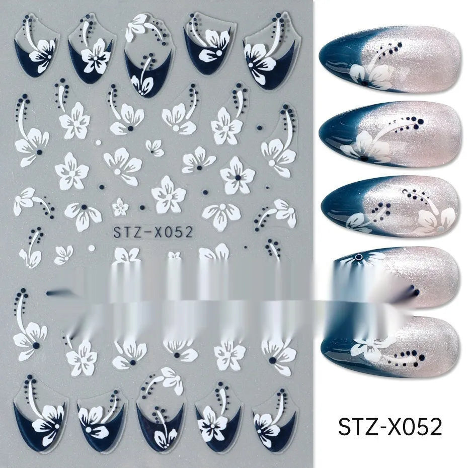 Set of 60 black and silver cartoon pattern nail strip stickers with plastic application patch.