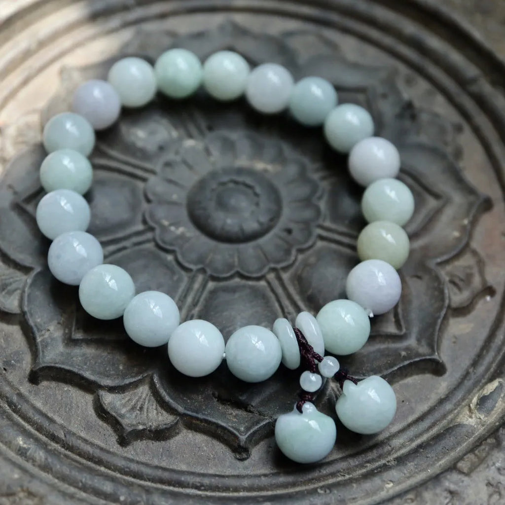 Natural emerald jade bracelet with hanging Maitreya Buddha charm and geometric design