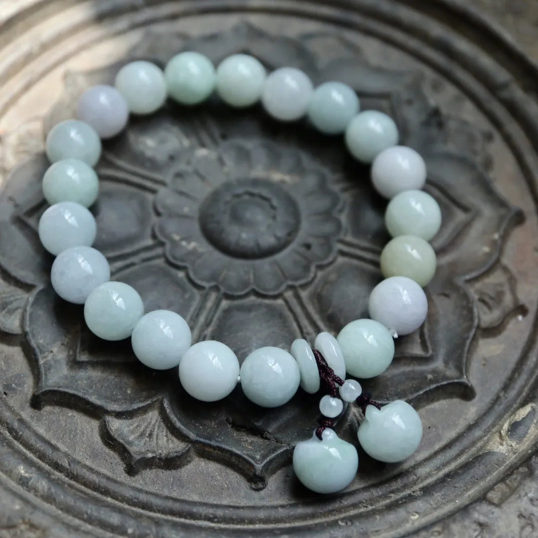 Natural emerald jade bracelet with hanging Maitreya Buddha charm and geometric design