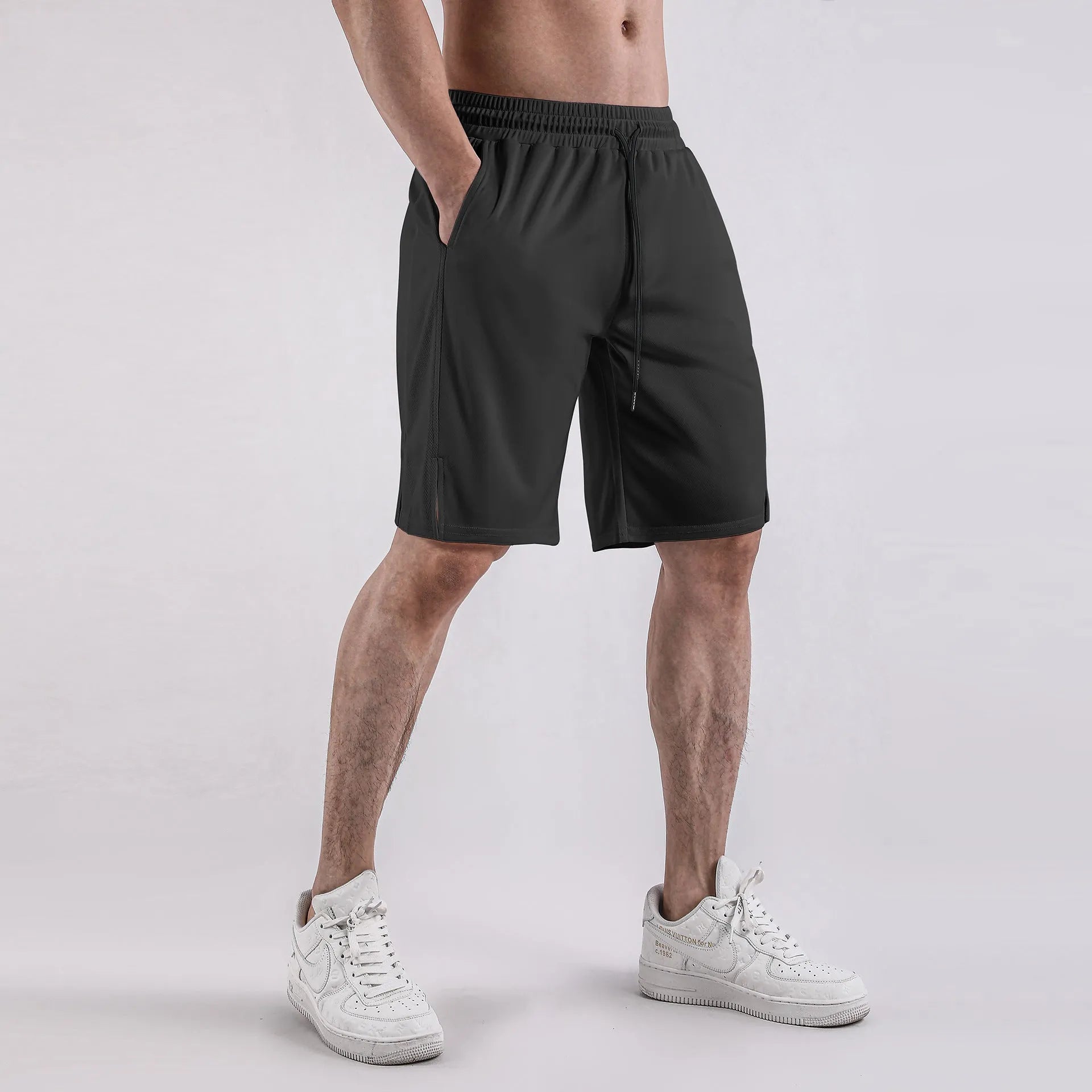 Men's black quick-drying mesh shorts with elastic waist and fifth pants length