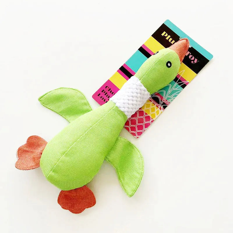 Blue durable pineapple cotton duck plush dog toy with squeakers on wooden floor
