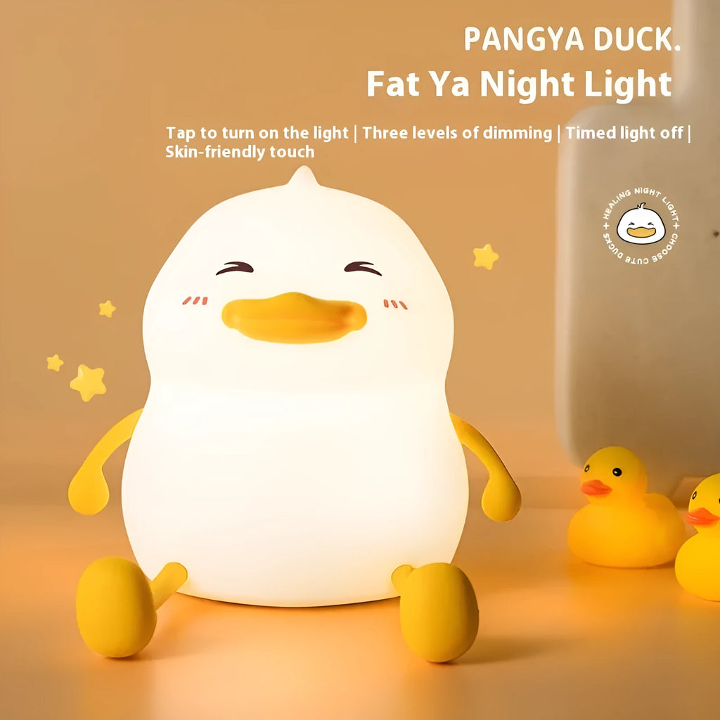 Chubby silicone night light with phone holder slot, showing touch controls and soft LED glow