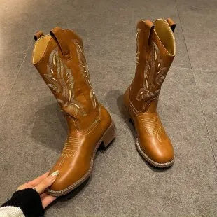 Brown women's embroidered Martin boots with a mid-calf height and low square heel.