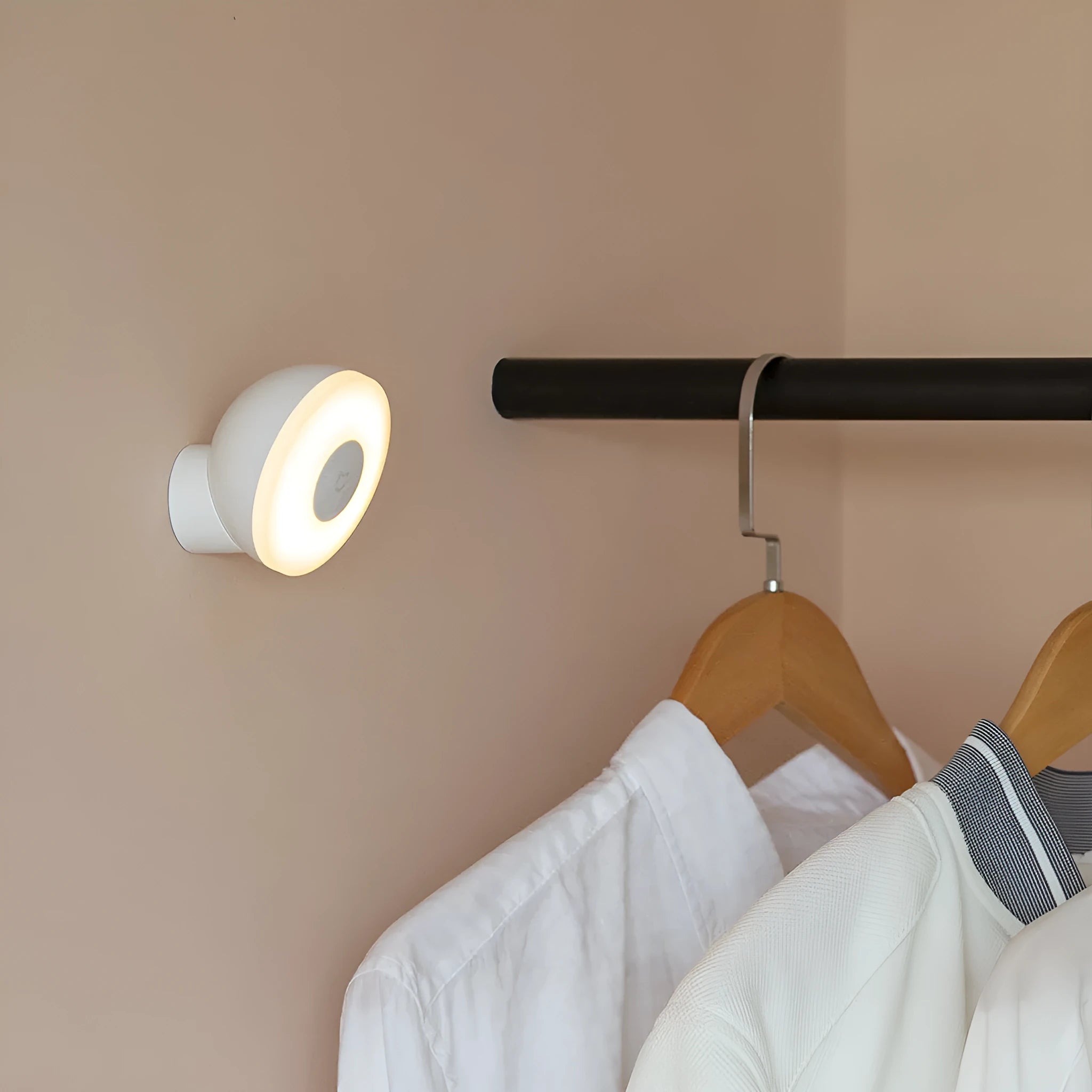 White square modern bedside table lamp with motion sensor and Bluetooth, shown on a nightstand.