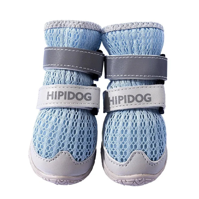 Cartoon style blue and green dog shoes for summer, showing breathable anti-scald design on a dog's paw.