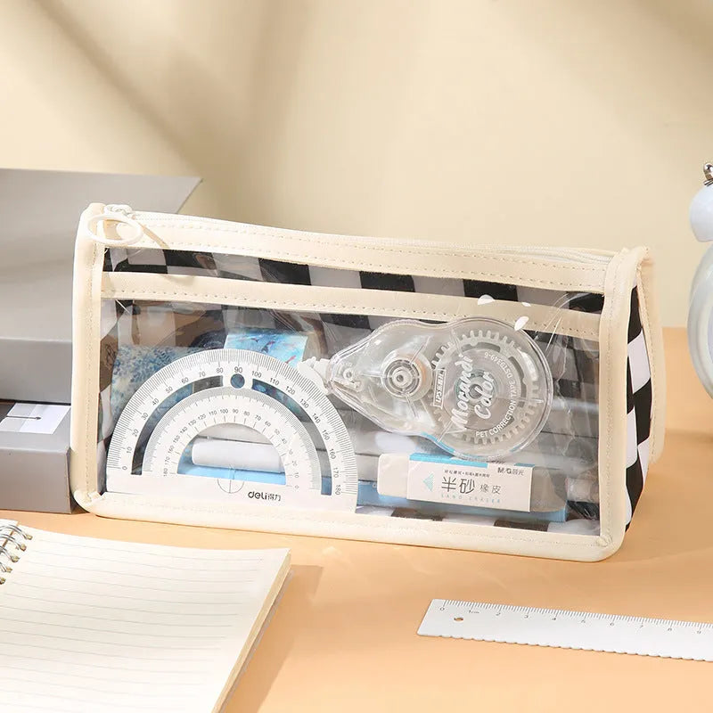 Large transparent PVC pencil case with a black and white chessboard grid pattern, showing pens inside.