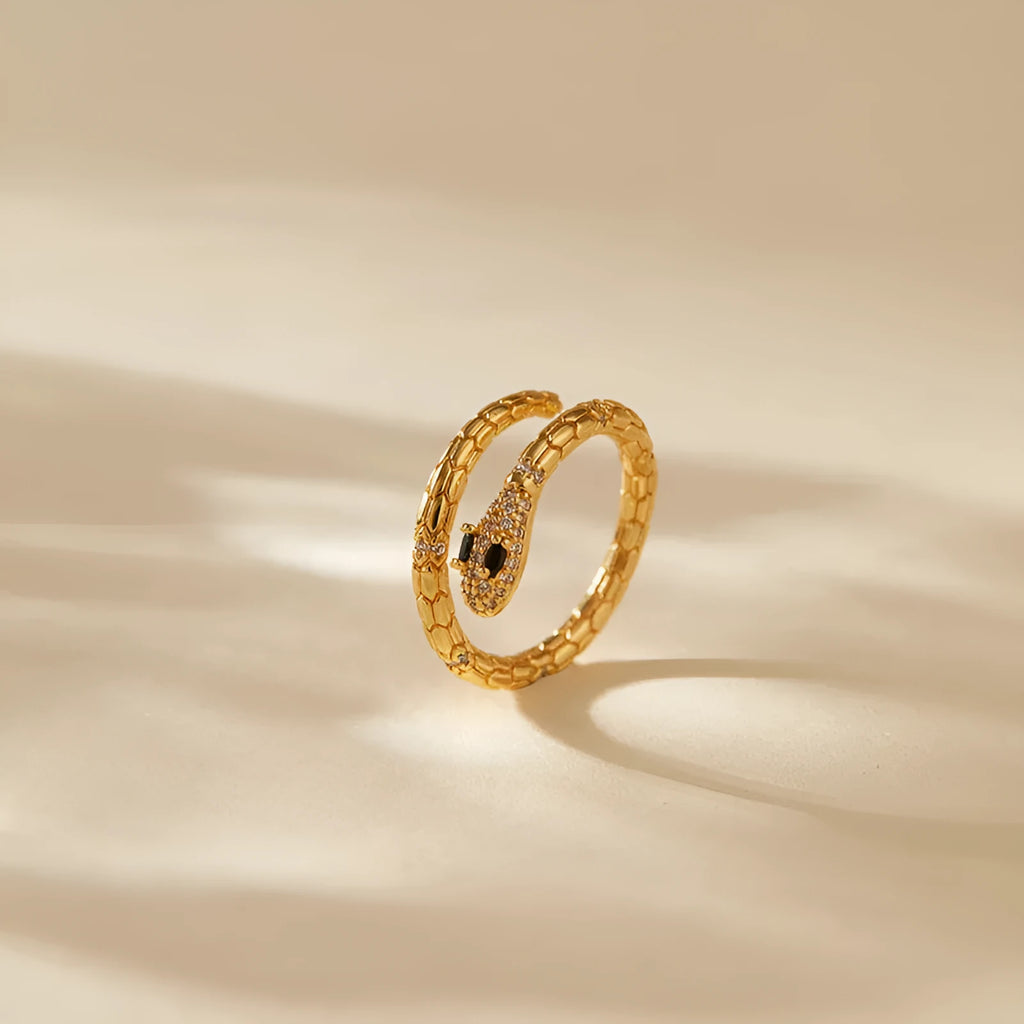 Snake-shaped adjustable copper ring with gold colour plating and diamond treatment
