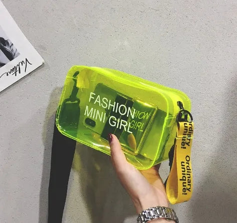 A transparent square jelly crossbody bag with a single adjustable shoulder strap.