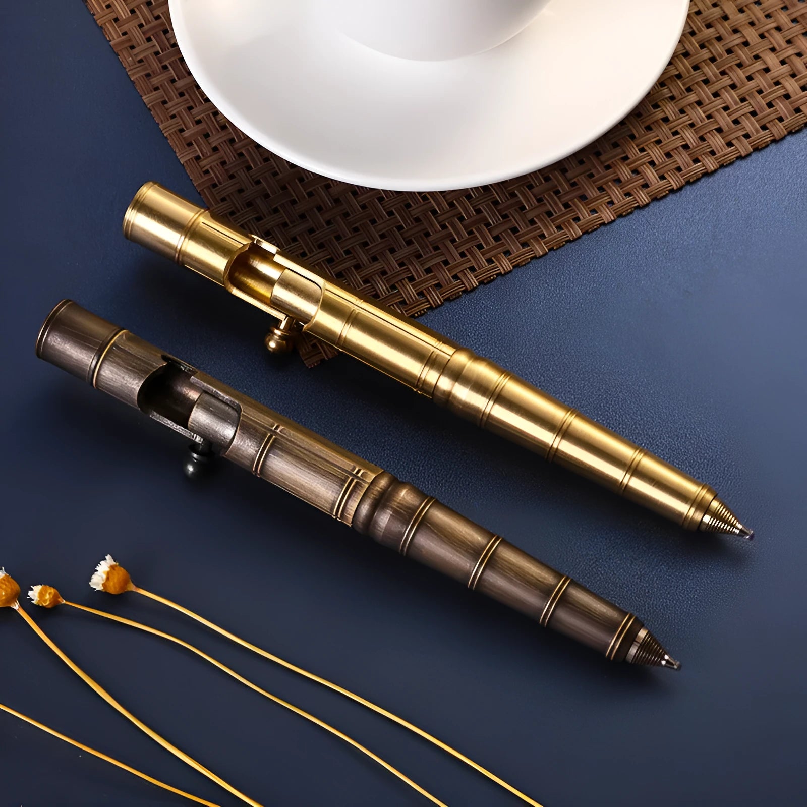 Brass tactical pen with bolt-action cylinder press mechanism in retro design