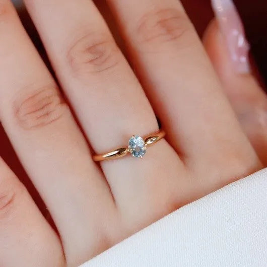 S925 sterling silver geometric ellipse ring with micro inlay finish in yellow gold colour on white background