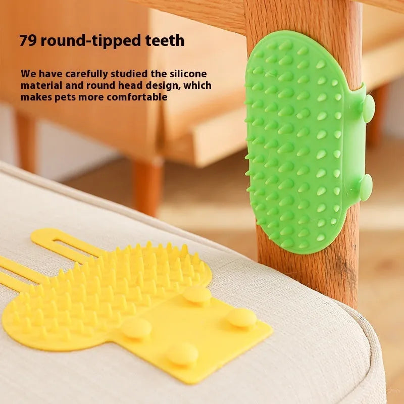 Silicone cat grooming comb with adjustable strap attached to furniture leg for scratching and hair removal