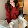 Women's long-sleeved acrylic sweater cardigan coat in milky white, shown as a layering piece.