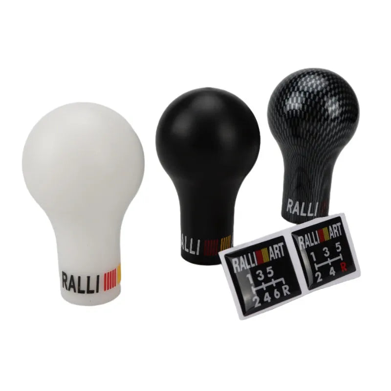 Manual automatic five-gear car gear head shifter in white, black, blue, red, and carbon fibre finishes.