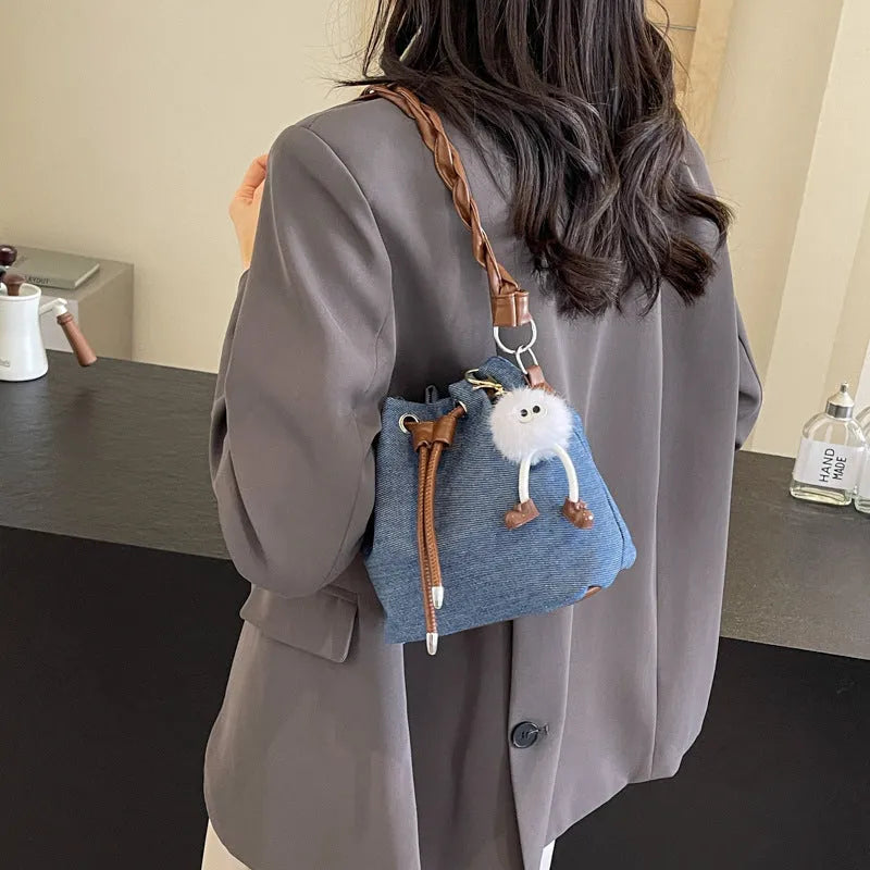 Blue one-shoulder cross-body bucket messenger bag with synthetic leather lining