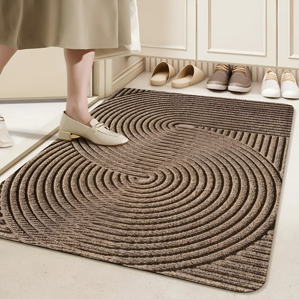 Green cartoon anime alien shaped silk ring entrance carpet measuring 60x90cm on a floor.