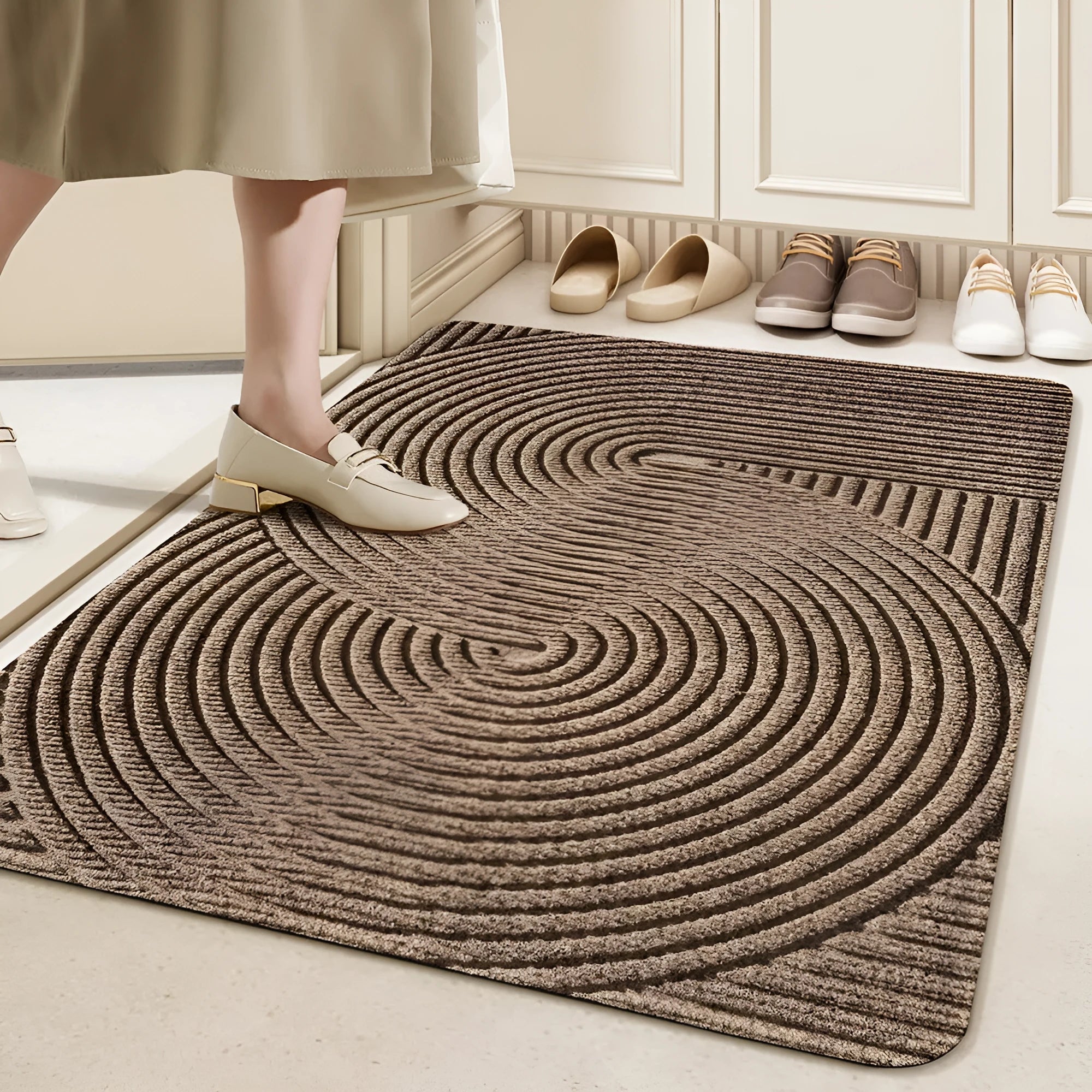 Green cartoon anime alien shaped silk ring entrance carpet measuring 60x90cm on a floor.