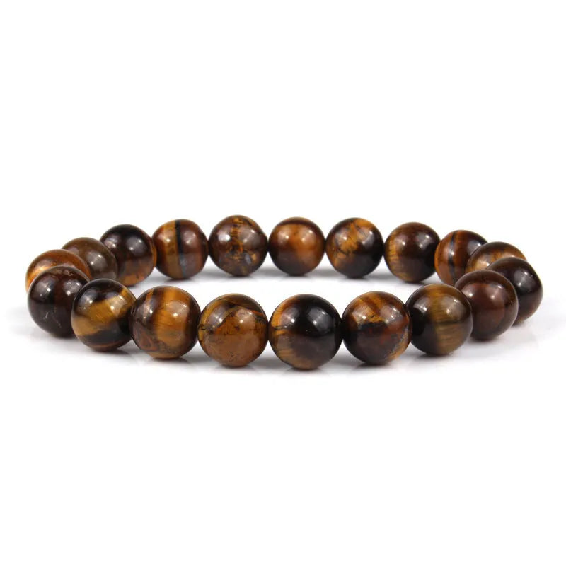 Tigereye crystal bead bracelet showing geometric round beads on a wrist.