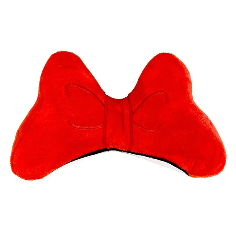 Soft plush bow tie decoration for motorcycle and ski helmets in red or pink colours.