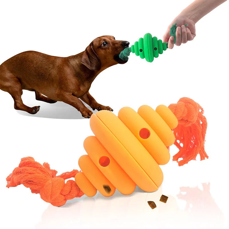 Green and yellow silicone dog ball with attached rope for tug-of-war and treat dispensing.