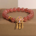 Women's strawberry quartz bracelet with four-leaf dream catcher ball pendant, original crystal jewellery design