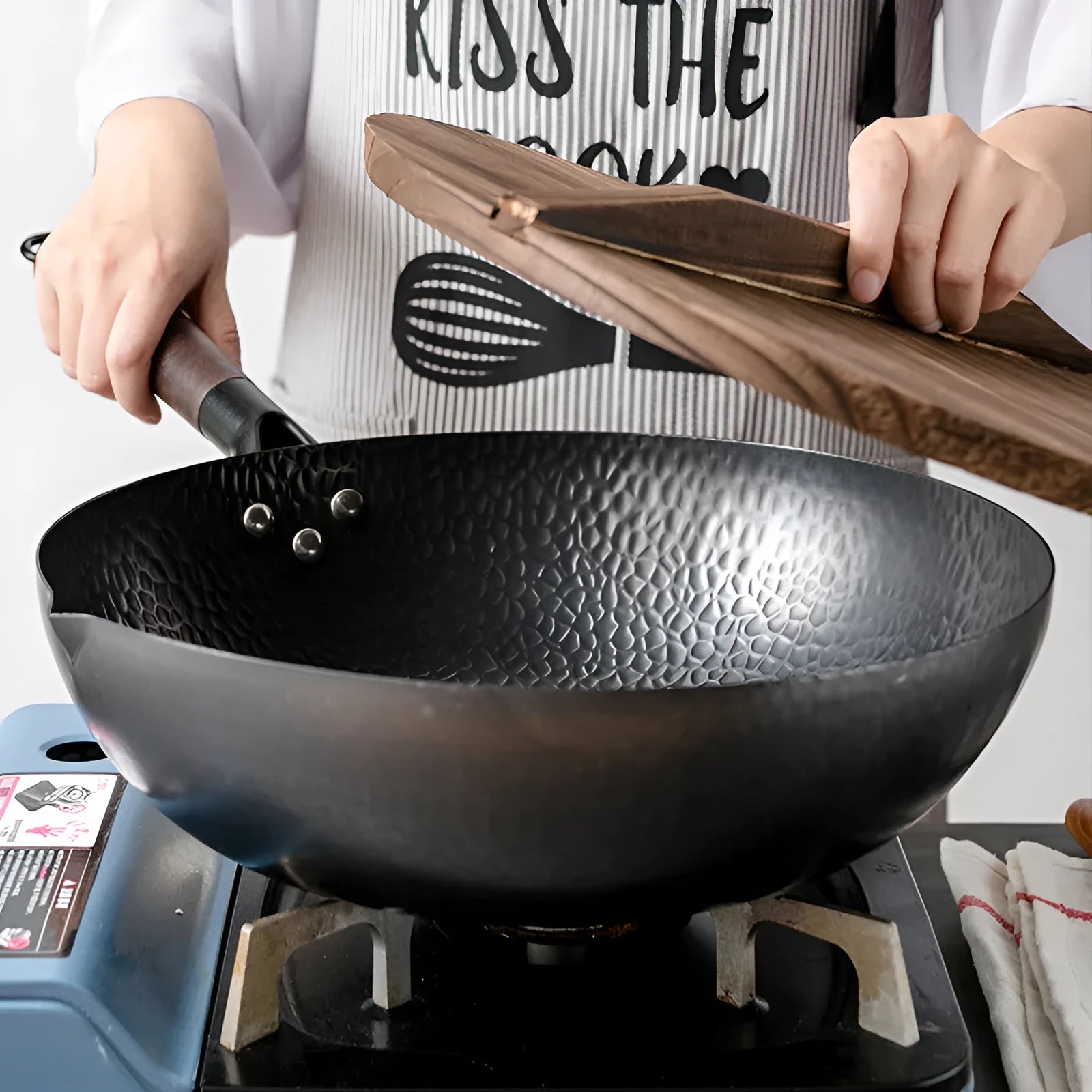 Traditional black iron wok with wooden handle measuring 32cm cooking surface diameter