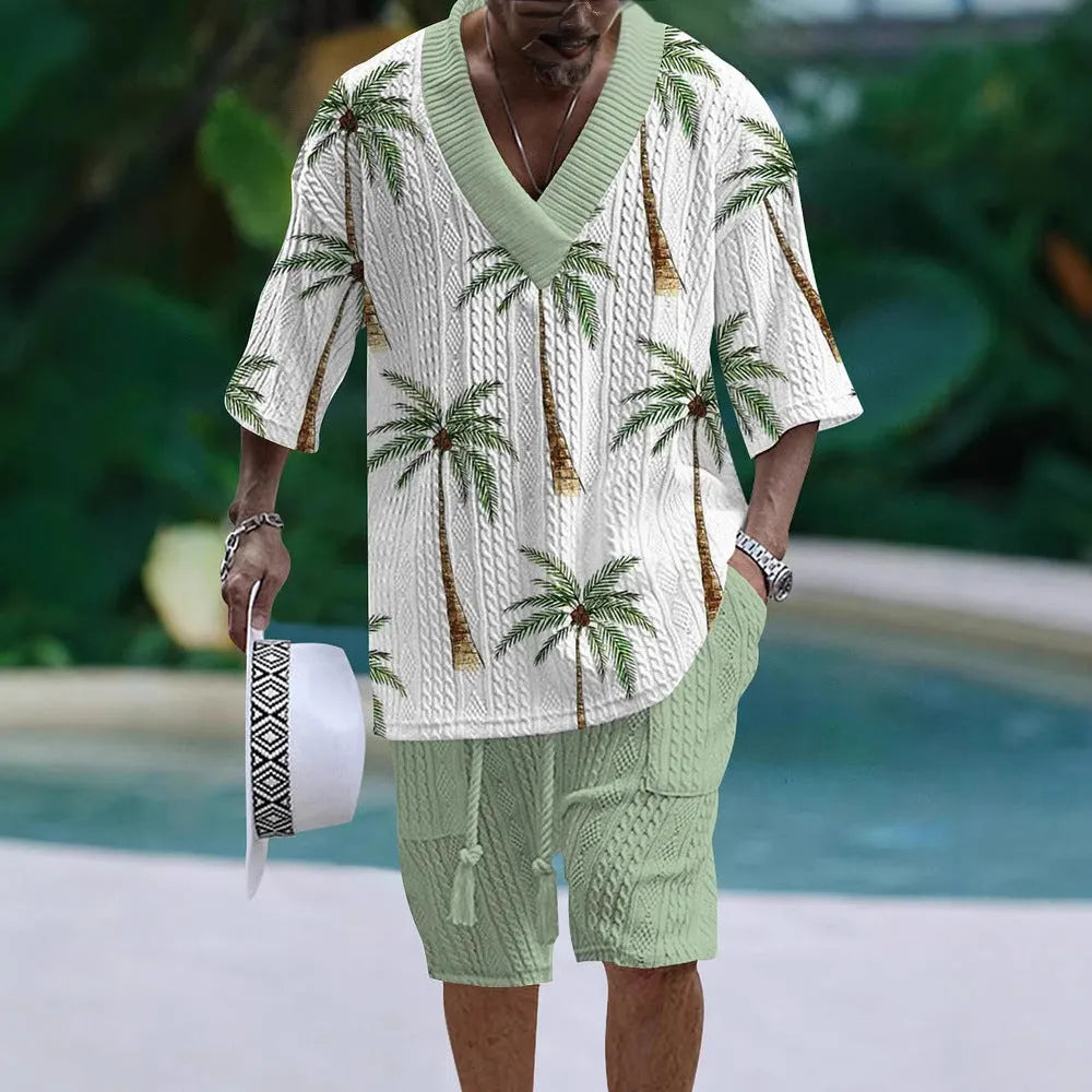 Man wearing a loose-fitting light blue short sleeve suit top and matching shorts on a casual summer day.