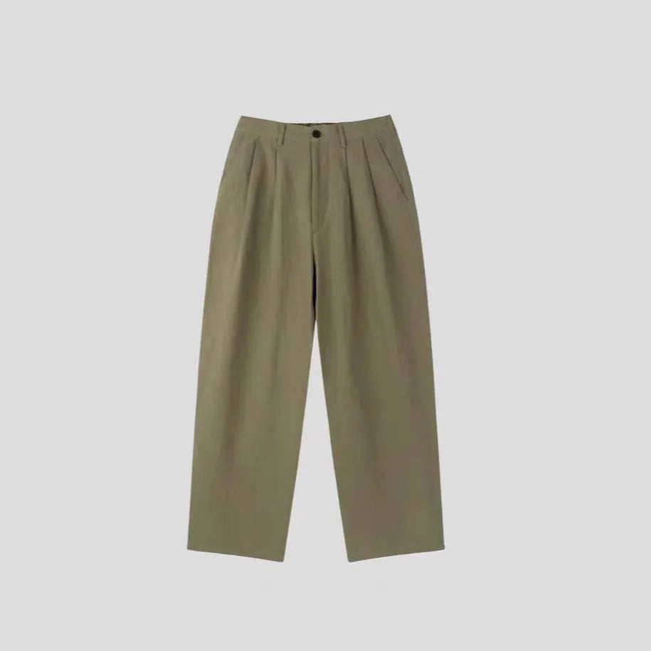Men's apricot-coloured loose-fit cotton linen trousers with a wide-leg cut and elastic waistband