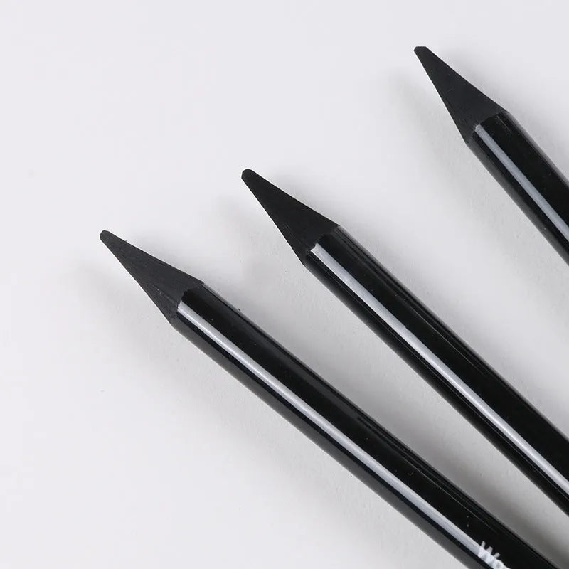 Set of nine wooden drawing pencils with six graphite and three carbonized pencils on suction card packaging