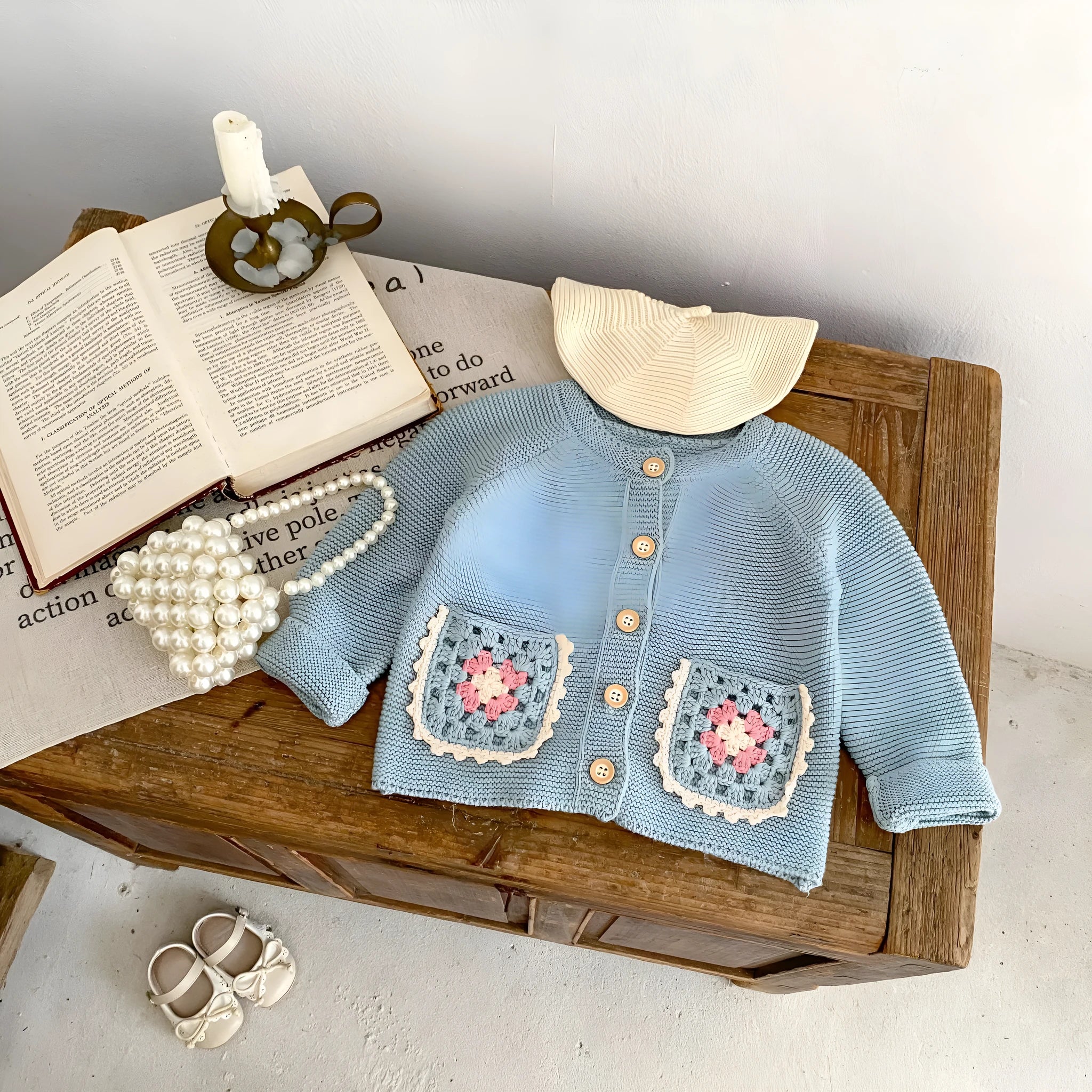 Children's hand crochet cotton cardigan in smokey blue with round collar and hollow flower pocket