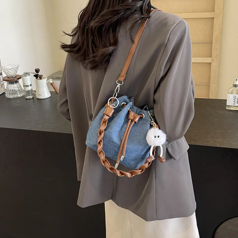 Blue one-shoulder cross-body bucket messenger bag with synthetic leather lining