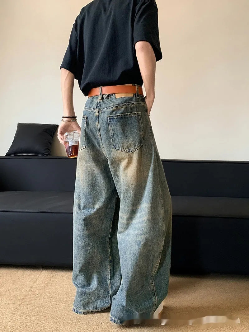 Men's retro blue distressed denim jeans with wide-leg cut and micro elasticity fabric