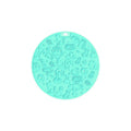 Round blue silicone pet licking mat with a central white suction cup on a kitchen tile.