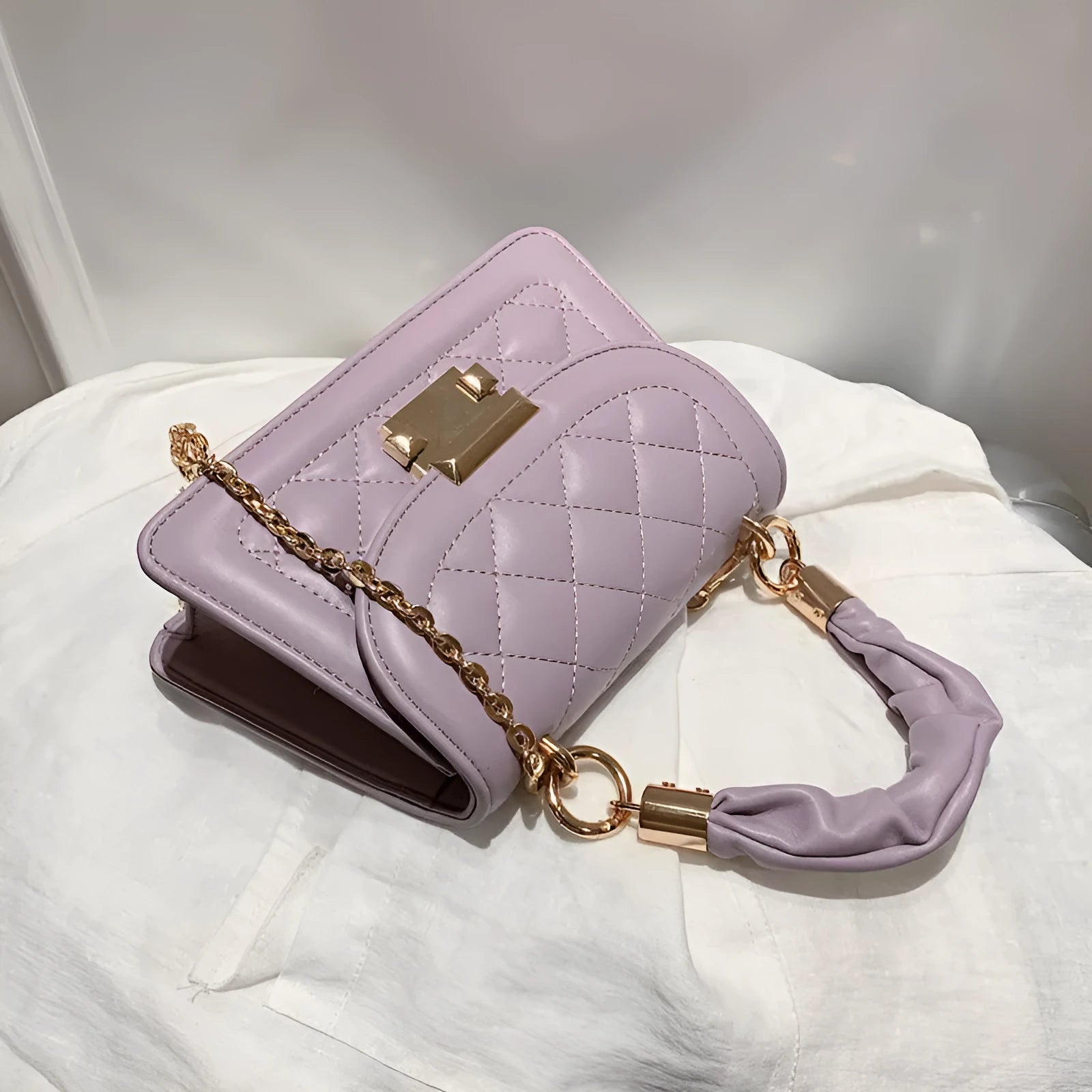 Korean style small square shoulder bag in purple with crossbody strap and structured design