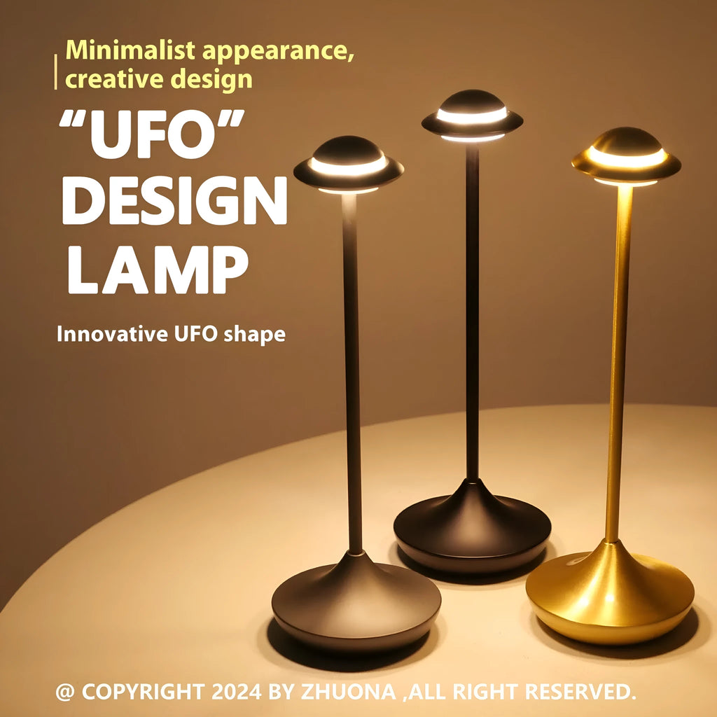 Modern creative UFO-shaped metal desk lamp with touch controls in black, gold, or grey finish.
