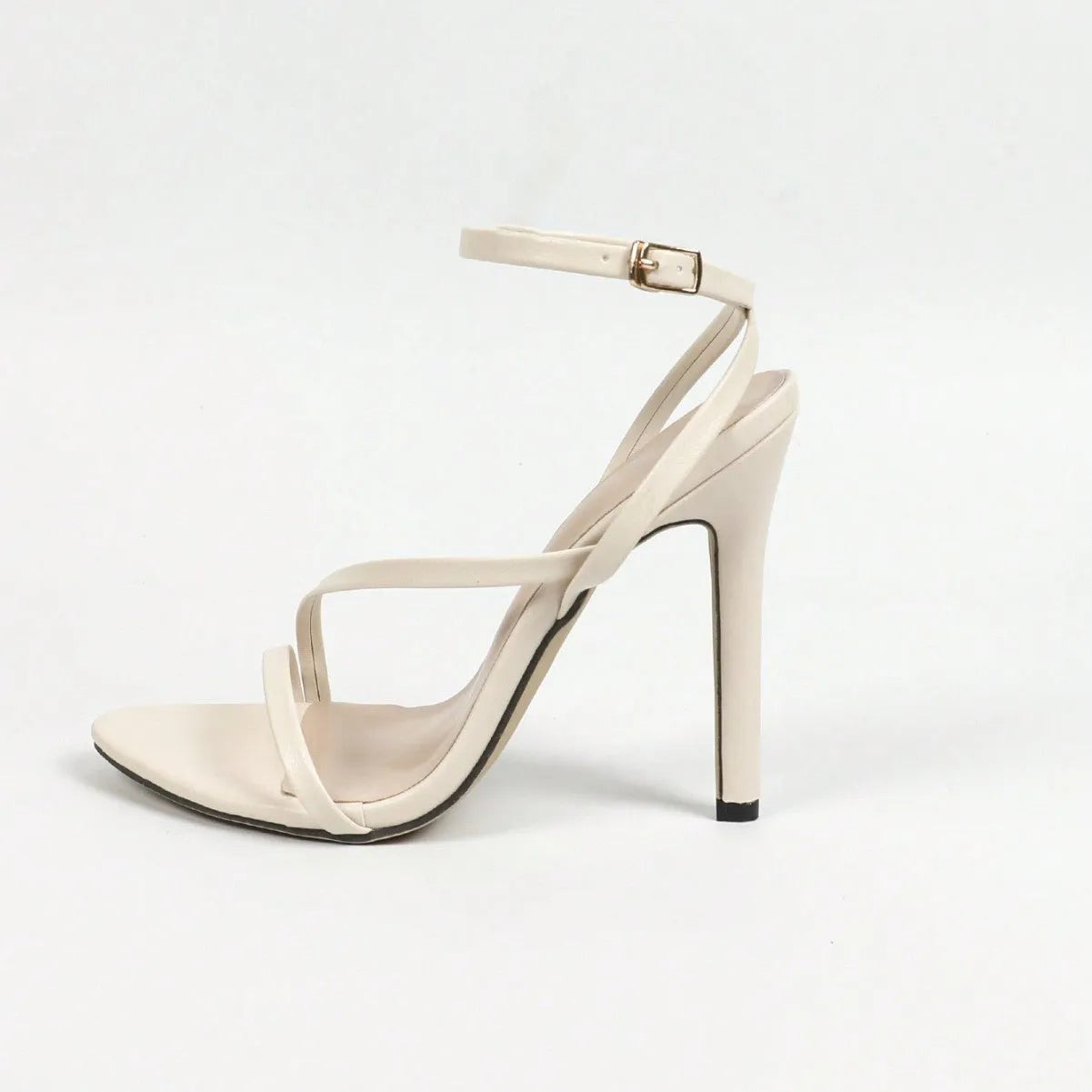 Women's gold heels with round toe, open toe, and multi-striped cross ankle straps